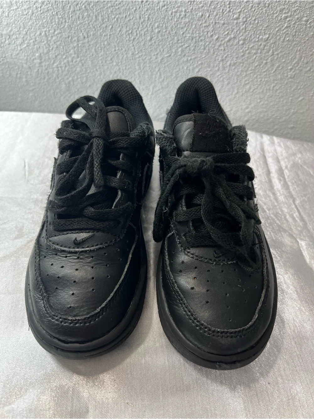 Nike Kids All-Black Leather Sneakers